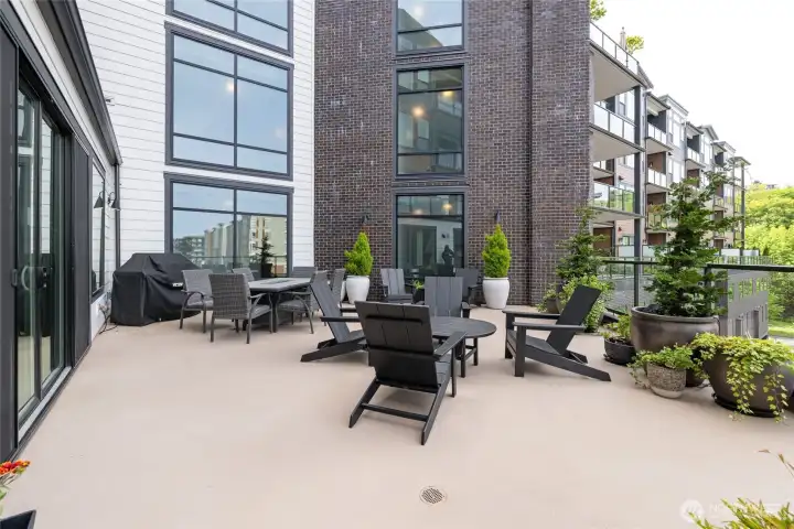 Expansive entertainment lounge featuring a pool table, grand piano, two kitchens, flexible party spaces, multiple seating and dining areas, plus outdoor deck and BBQ area