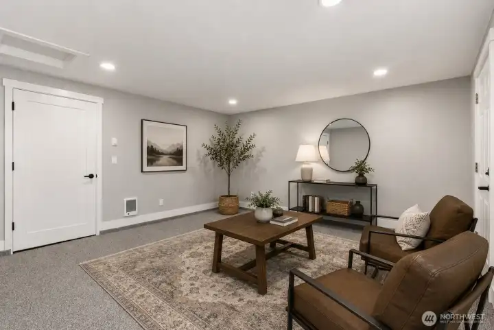 Bedroom #4 with exterior access offers endless flexibility, perfect for a home office, guest bedroom, hobby room, or creative space. Virtually staged furniture shown for inspiration.