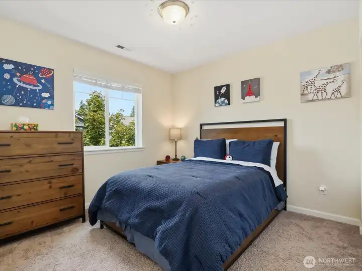 This bedroom has a custom organizer in the closet, too.