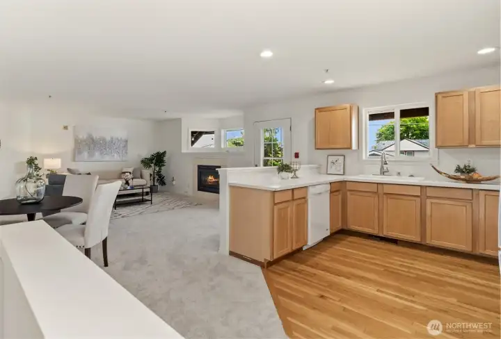 This is the open-concept setup you actually want, where the kitchen stays connected to the conversation and you're a part of all that's happening.