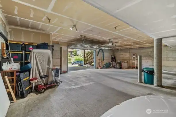 With all three neighboring units currently owner-occupied, this small building has a cared-for, communal feel that you notice right away, even down here in the shared garage.