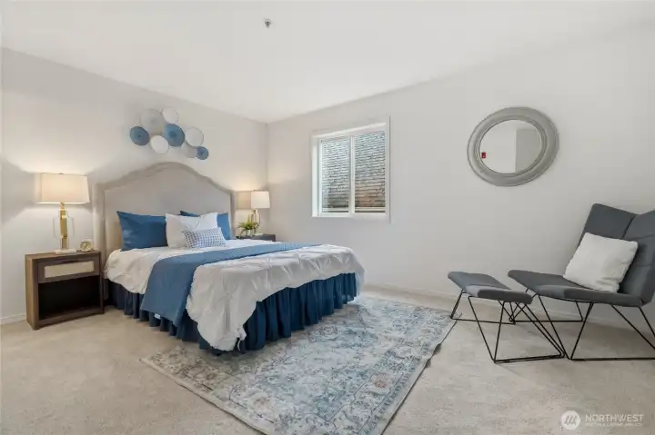 You’ll love the generous size of the primary bedroom, with space to settle in and make it your own.