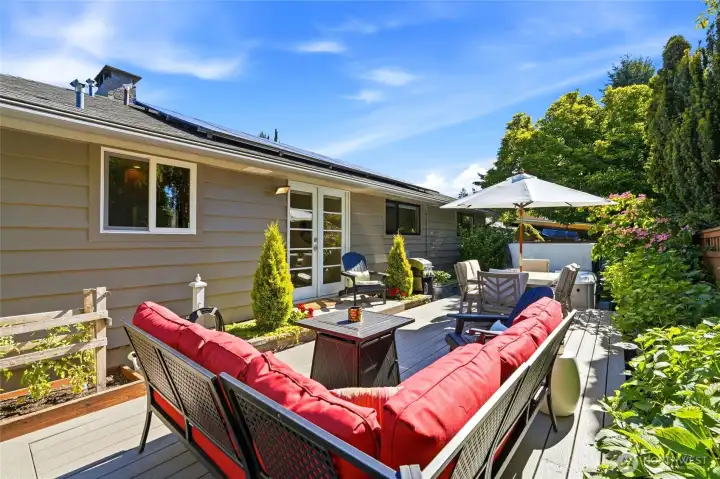 Relax in the hot tub, entertain on the deck, or enjoy the mature landscaping & garden spaces