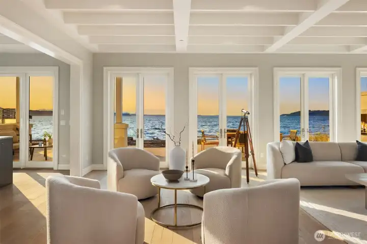 Inside, walls of French doors open onto a full-width patio with the water as a captivating backdrop, leaving you with an invigorating sense of being part of something both magical and powerful.