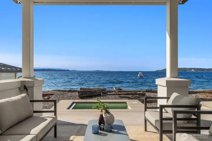 Step onto the covered, year-round patio, warmed by a ceiling heater, then wander down for a refreshing dip in the Sound before unwinding in the hot spa with a glass of your favorite drink in hand.