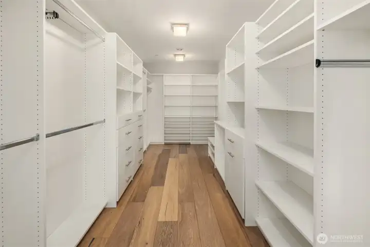 A generously scaled, custom walk-in closet, designed as a private dressing sanctuary.