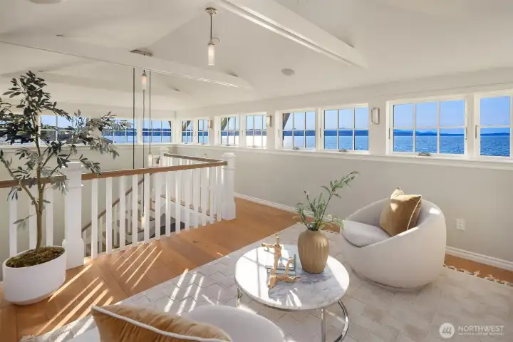 The upper-level observatory crowns the home with a 360-degree panorama—from the islands across the Sound to Mount Rainier and Normandy Park in the distance.