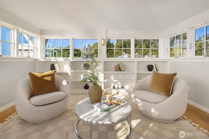 A sunlit sanctuary, perfectly suited for quiet reading, soulful meditation, or blossoming creativity as an inspiring art studio.