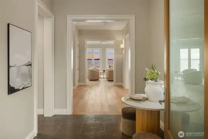 View of the main foyer, where clean architectural lines & refined stone flooring create a gracious first impression—an inviting prelude to the character & warmth found throughout the rest of the home.