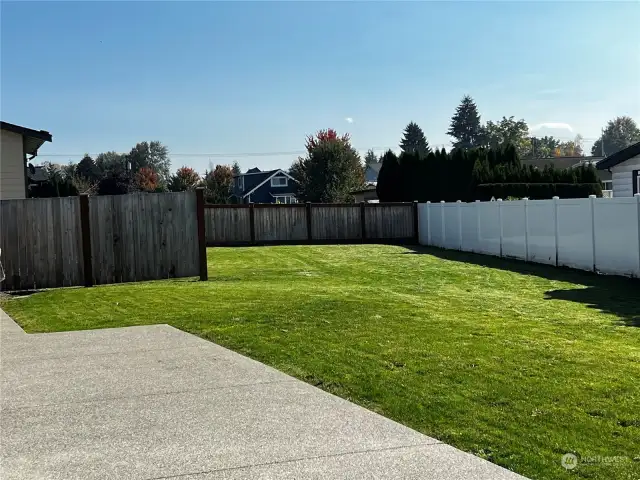 Another View of the Rear Yard and the DETACHED GARAGE in the Background.