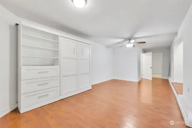 Fantastic finished basement is accessible from the bath yard. It's 832 square feet. This main room comes complete with a Murphy bed.