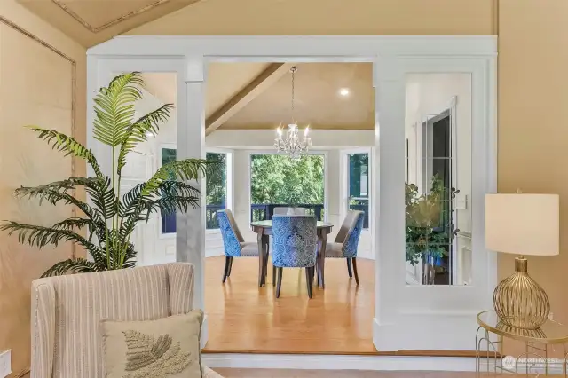 Dine in the natural light of this elegant formal dining room, that connects the living room and kitchen.