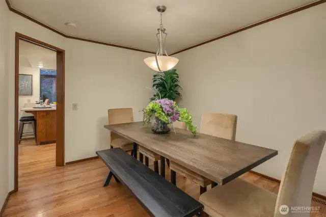 The dining room has easy access to the kitchen area with bar seating, making entertaining seamless.