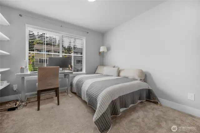 Upper level bedroom with built-ins