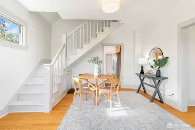 Stairs lead to the second floor and two additional bedrooms.