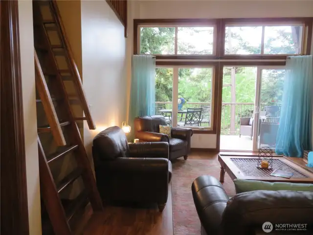 From living room, loft up the ladder to the left.