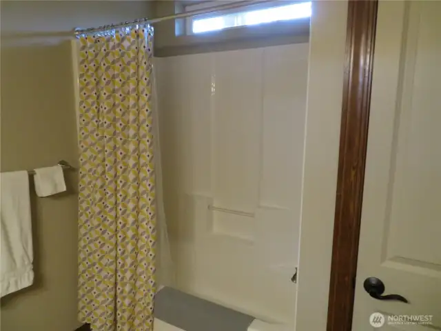 Second full bathroom - small window above.  Linen closet in the bathrrom shown here to the right..