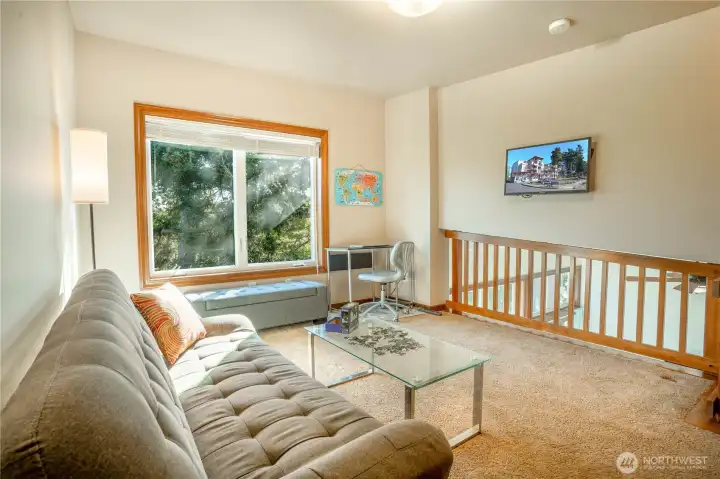 The open loft shown with the TV screen.