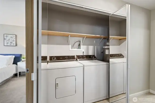 Hall utility closet with full size washer/dryer and new hot water tank