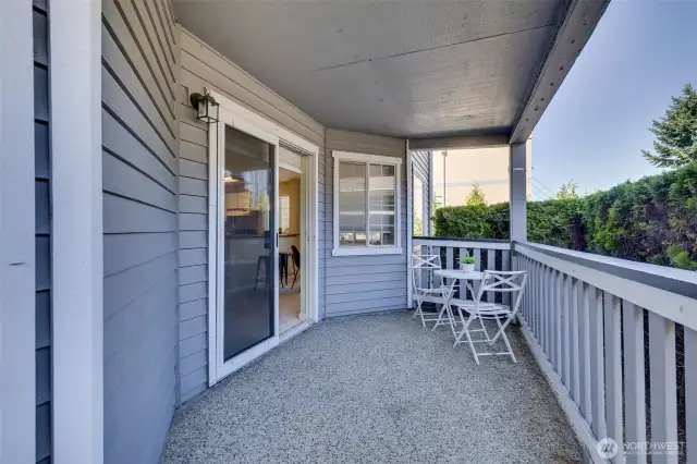 Large fully covered private patio with 1 of 2 storage units