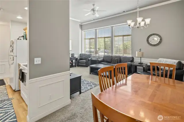 Looking from dining area towards kitchen and living room.