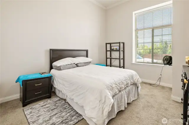 Bedroom with closet and storage area.