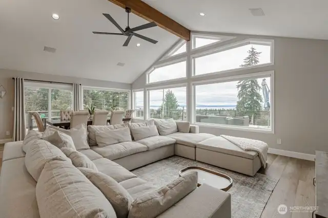 Vaulted ceilings and soft neutral tones enhance the airy atmosphere for a grand feel.