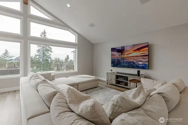 Spacious family room summons relaxation.