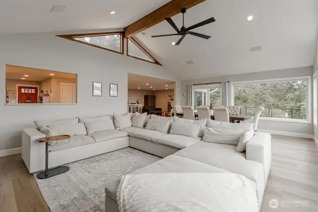 The family room features a cutout to the kitchen that provides a convenient pass-through for food and drinks and keeps the conversation flowing between the spaces.