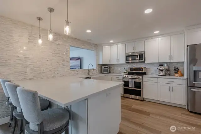 The gourmet kitchen with a peninsula and eating bar is sure to delight any chef.