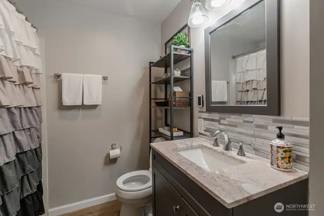 Full bath with a tub/shower combo on the lower level.