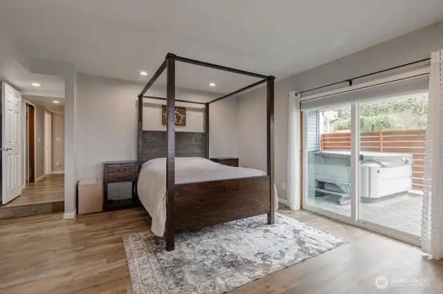 Lower level primary bedroom with private access to the hot tub.