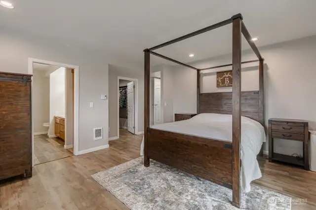 The primary bedroom features a private bath and a large walk-in closet.