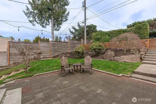 Front yard view; fenced for privacy.