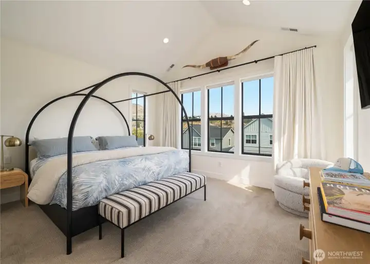 Primary Suite: Four Seasons® mattress, black out drapery, vaulted ceilings, reading nook with views of The Butte.