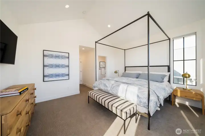 The Primary Suite: Four Seasons® mattress, designer furniture, and newly installed drapery (not shown).