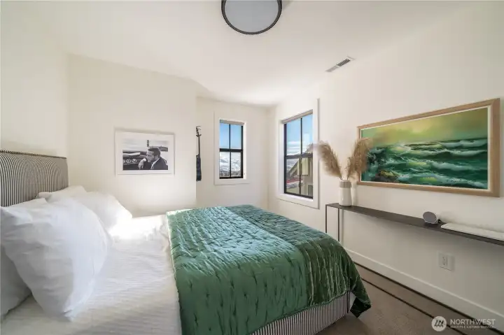 The Guest Suite: Trendy drum light, walk in closet, Queen size bed.