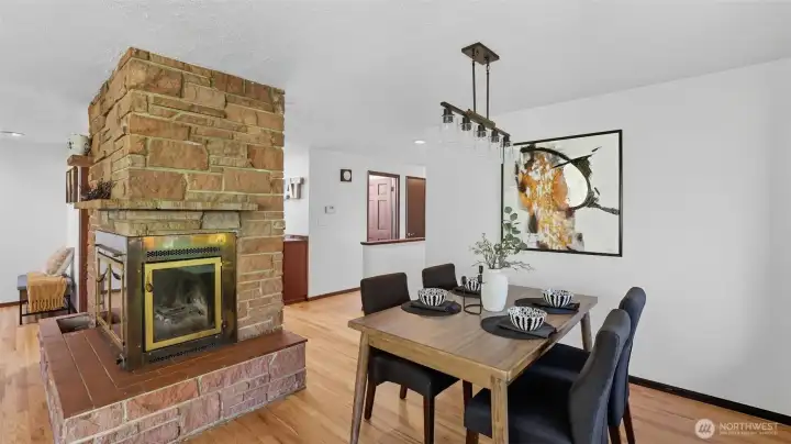 This spacious living room design offers a convenient transition into the dining area - ideal for quiet meals or hosting!