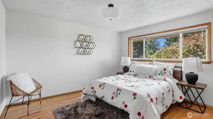 retreat to this beautiful primary suite, bathed in natural light.