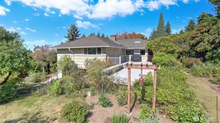 Surrounded by mature landscaping and colorful plantings for year-round beauty.