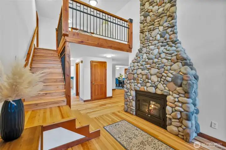 Entrance with vaulted ceilings and a loft overlooking the front door