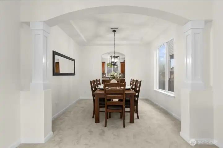Formal dining featuring arches and columns