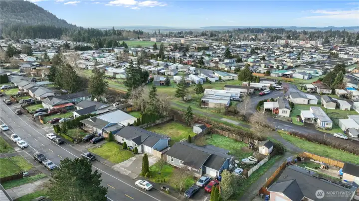 Aerial neighborhood view highlighting the home’s location, nearby streets, and surrounding community.