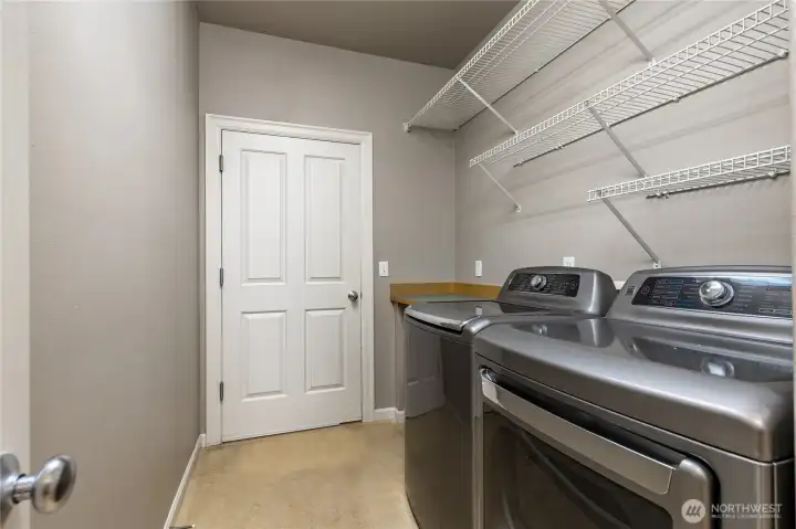 Laundry room with door to the attached 3-car garage