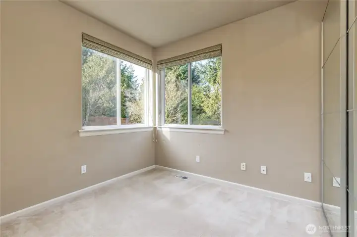 Main floor office or 5th bedroom includes bright corner windows