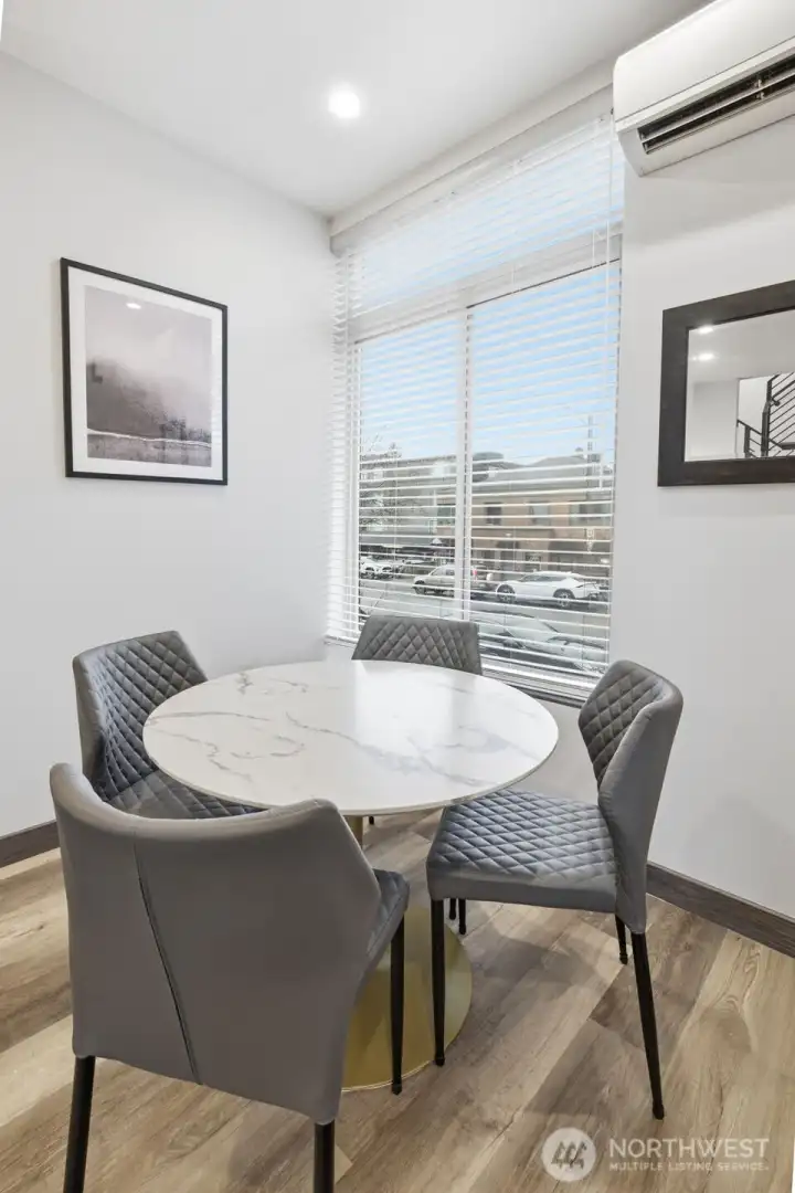 Dining space positioned off the living area, offering natural light and easy flow for modern living.