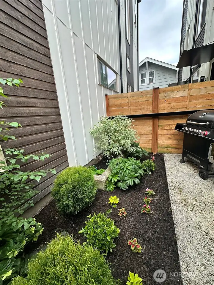 Sweet back patio area, perfect for a BBQ and bistro table.