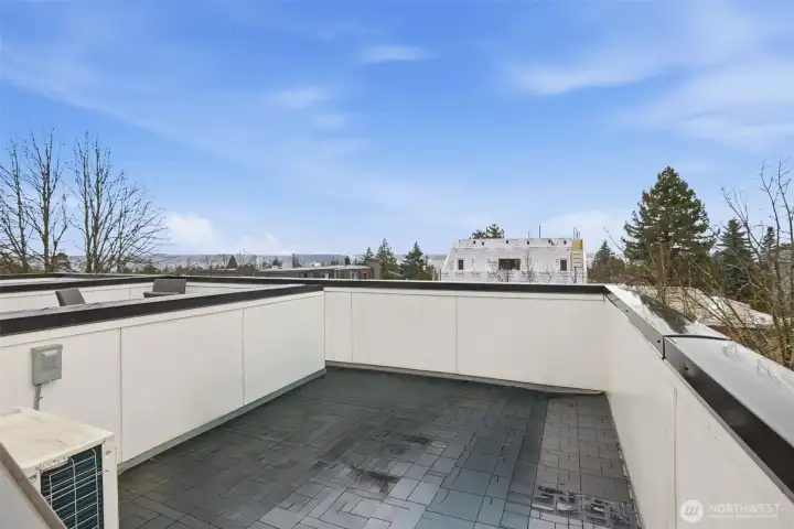 The rooftop deck awaits for breathtaking sunsets and water views.