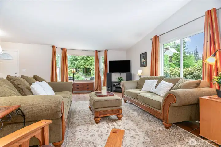 Large windows flood the living room with plenty of light.