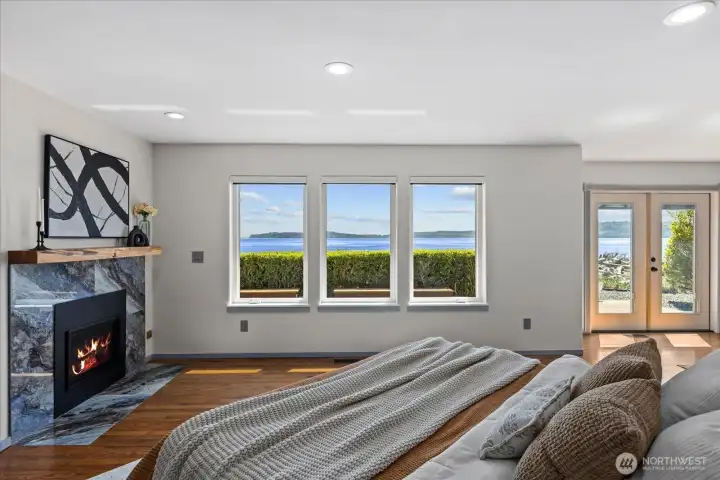 Primary bedroom with custom fireplace.